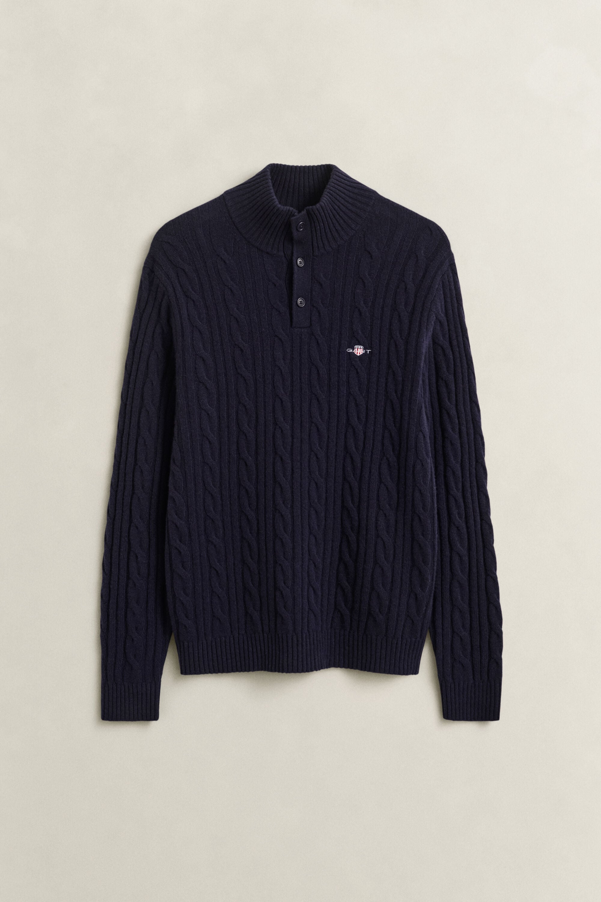 Pull semi-boutonné en laine d’agneau à maille torsadée