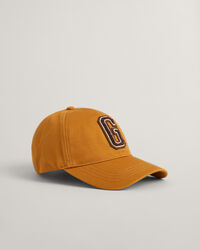 Pet met G-badge van katoenkeper