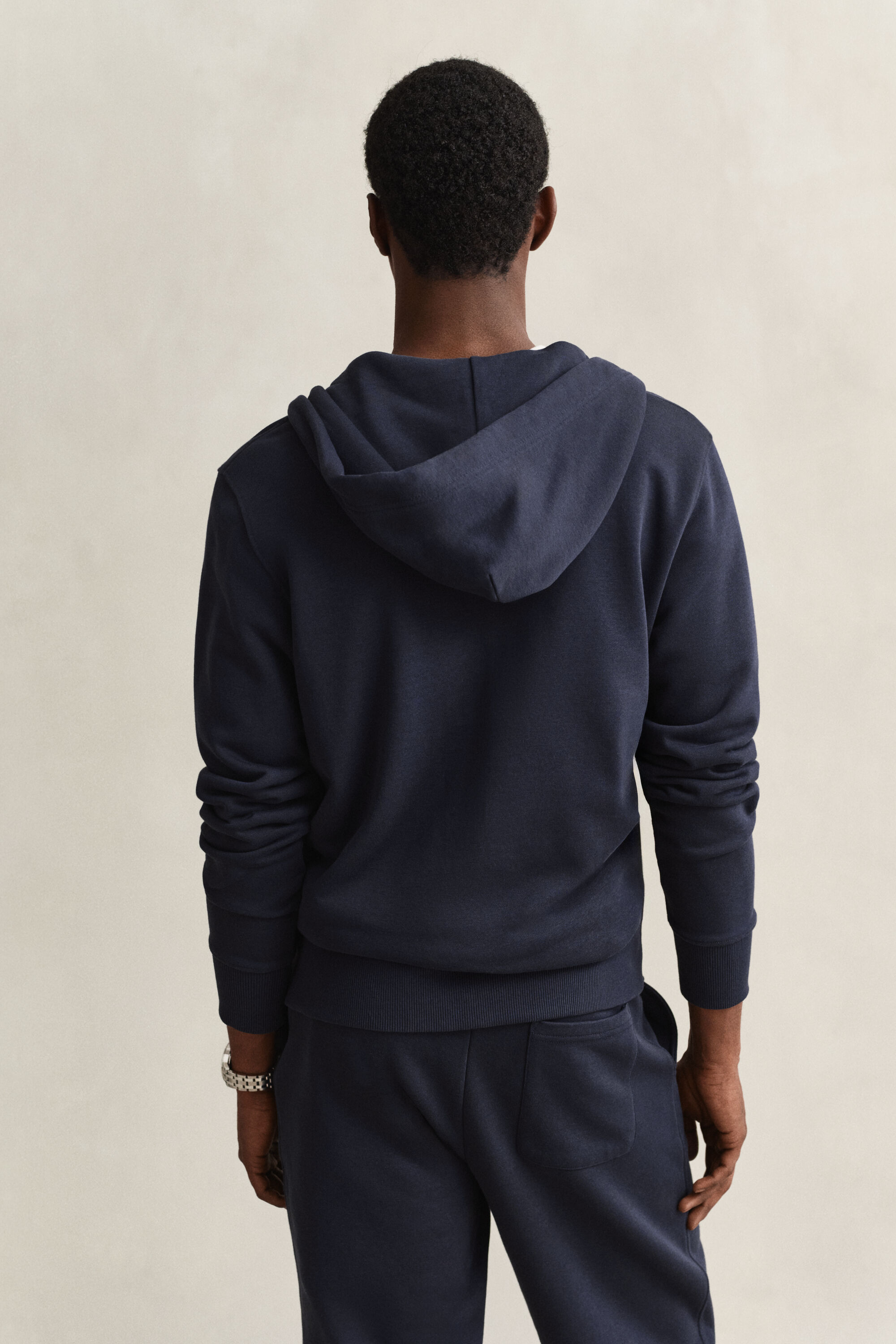Sweat à capuche zippé avec écusson