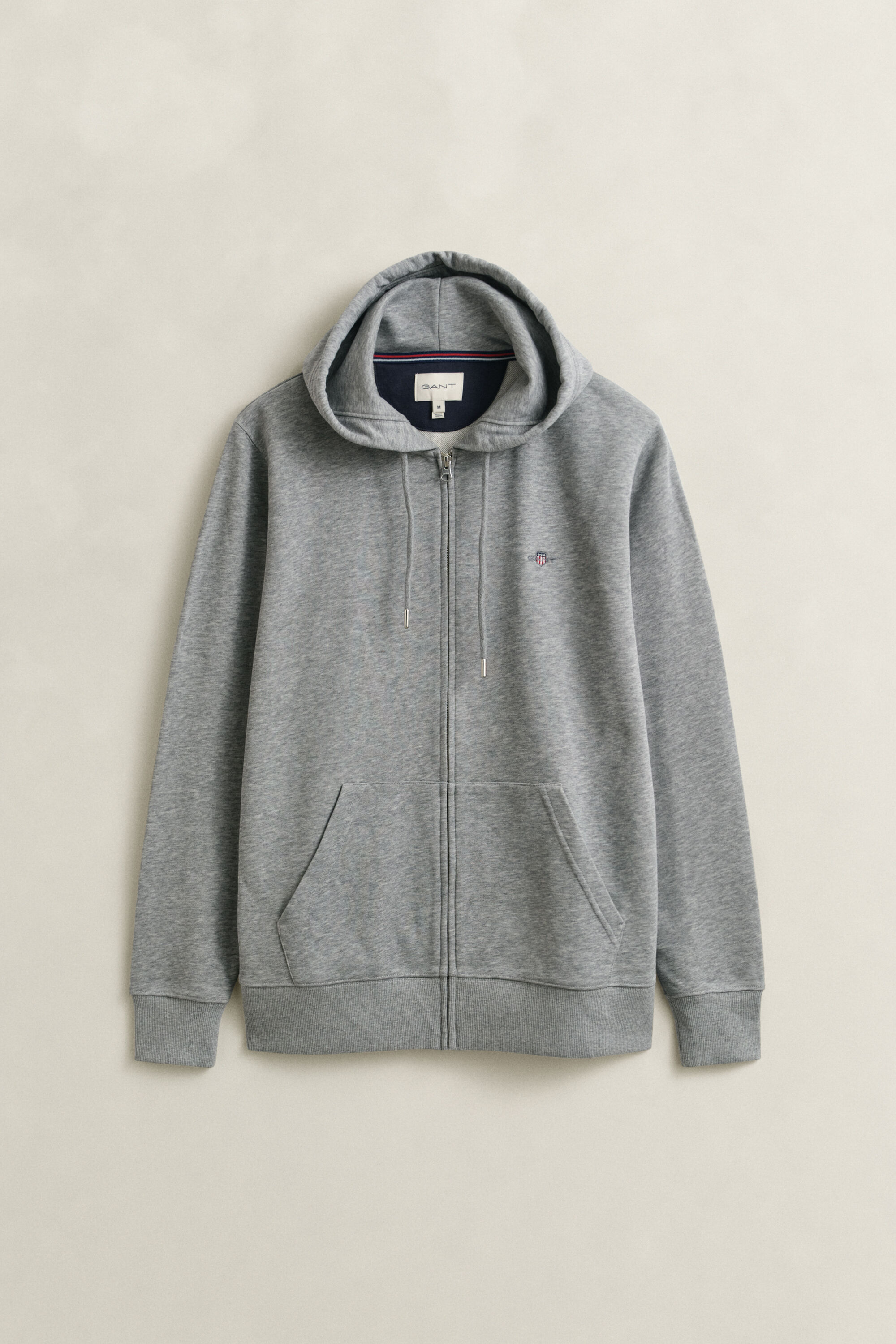 Sweat à capuche zippé avec écusson