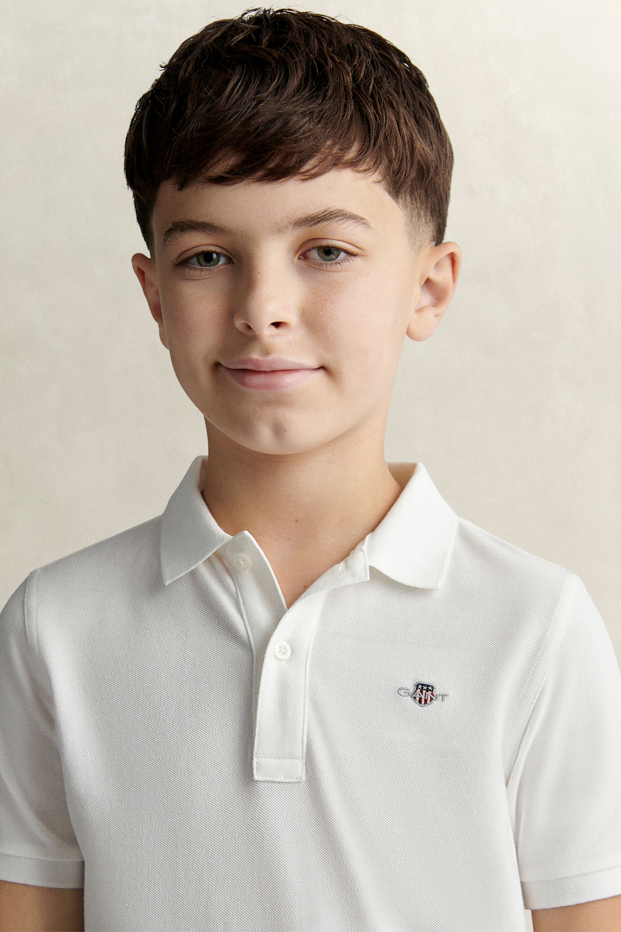 Poloshirt met schild voor tieners