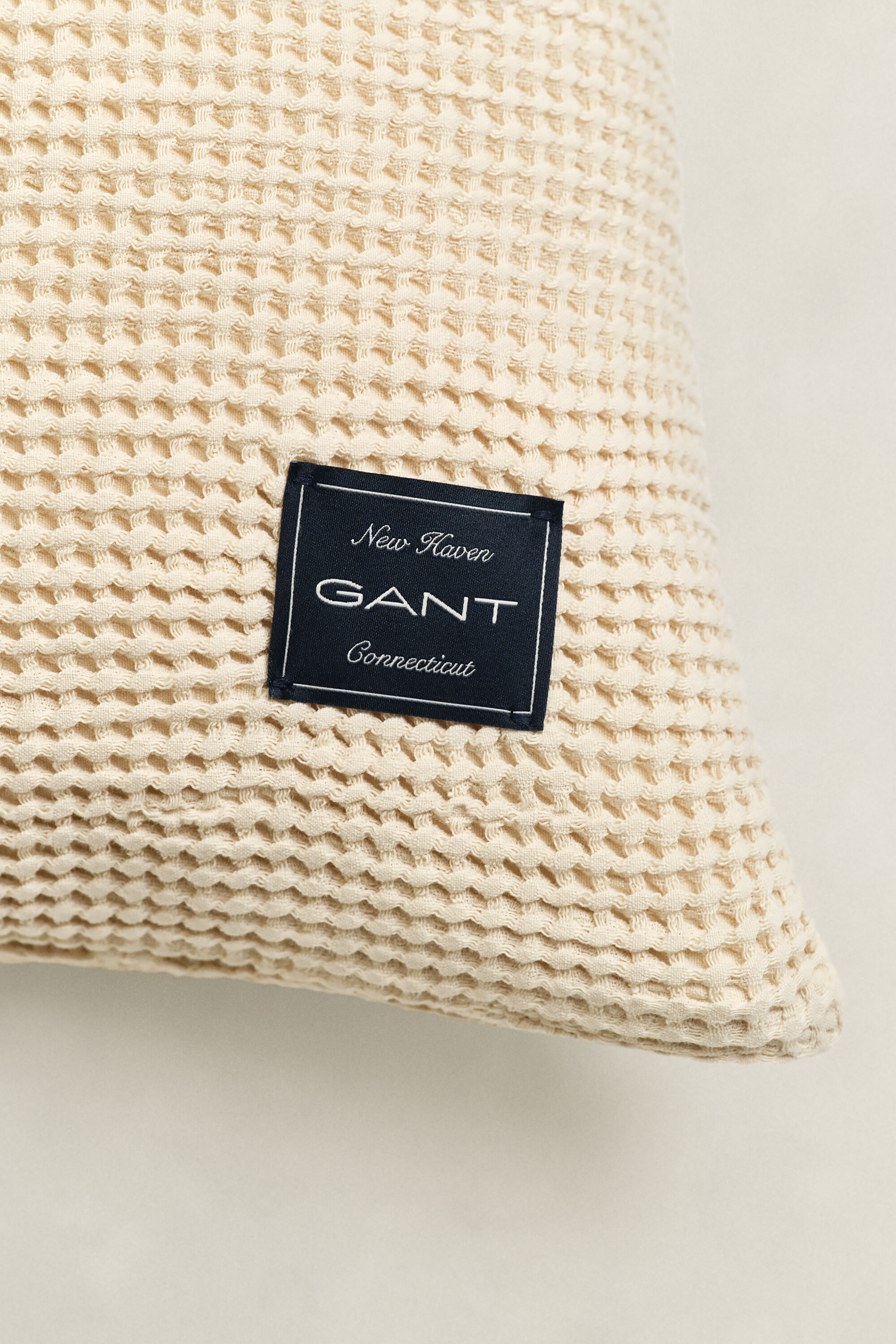 Housse de coussin en coton à texture gaufrée