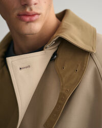 Trench-coat à coutures fixées