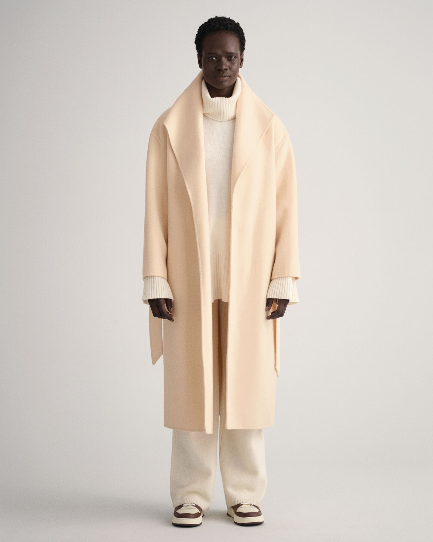 Manteau cousu main avec ceinture