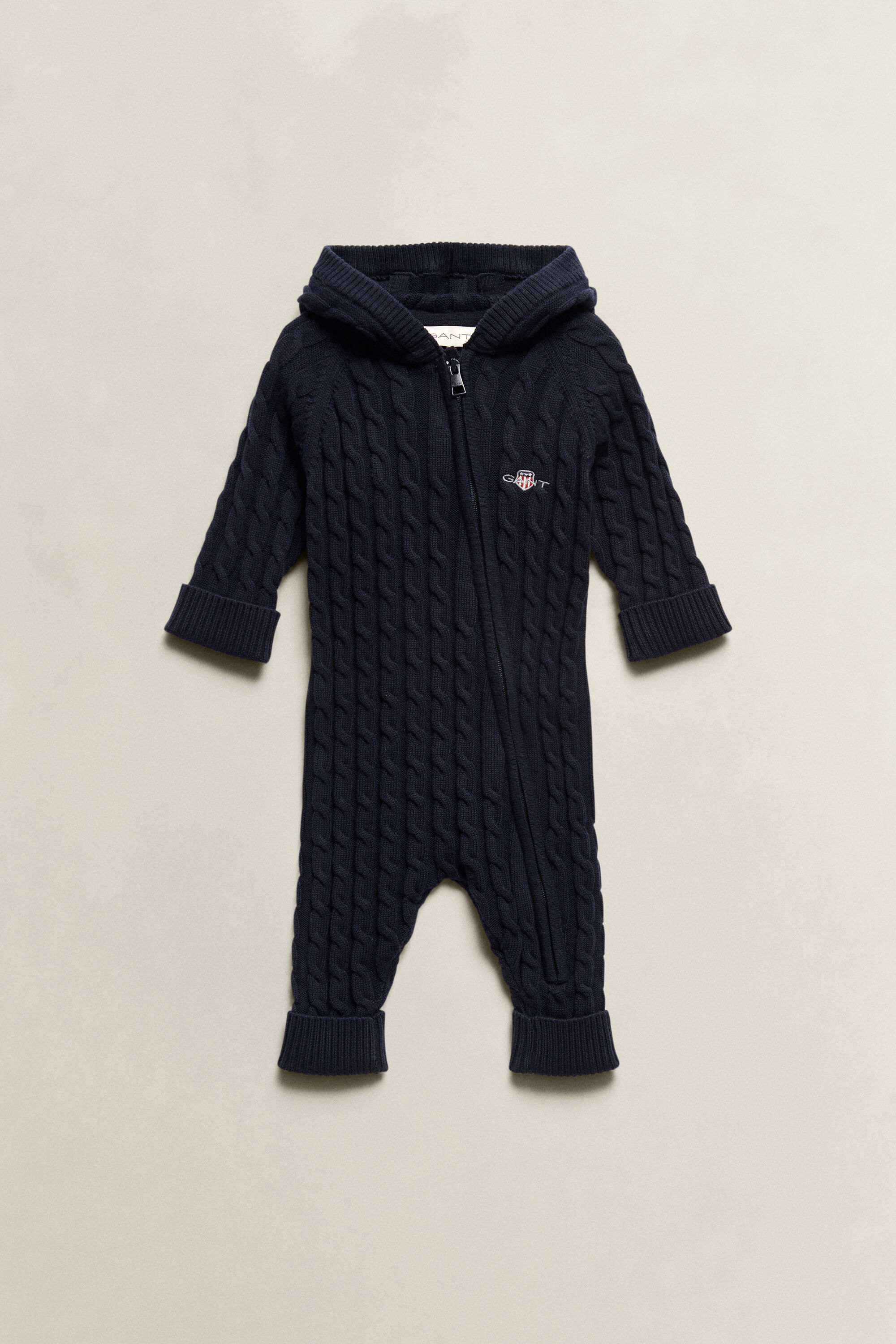 Combinaison en maille torsadée avec écusson Bébé