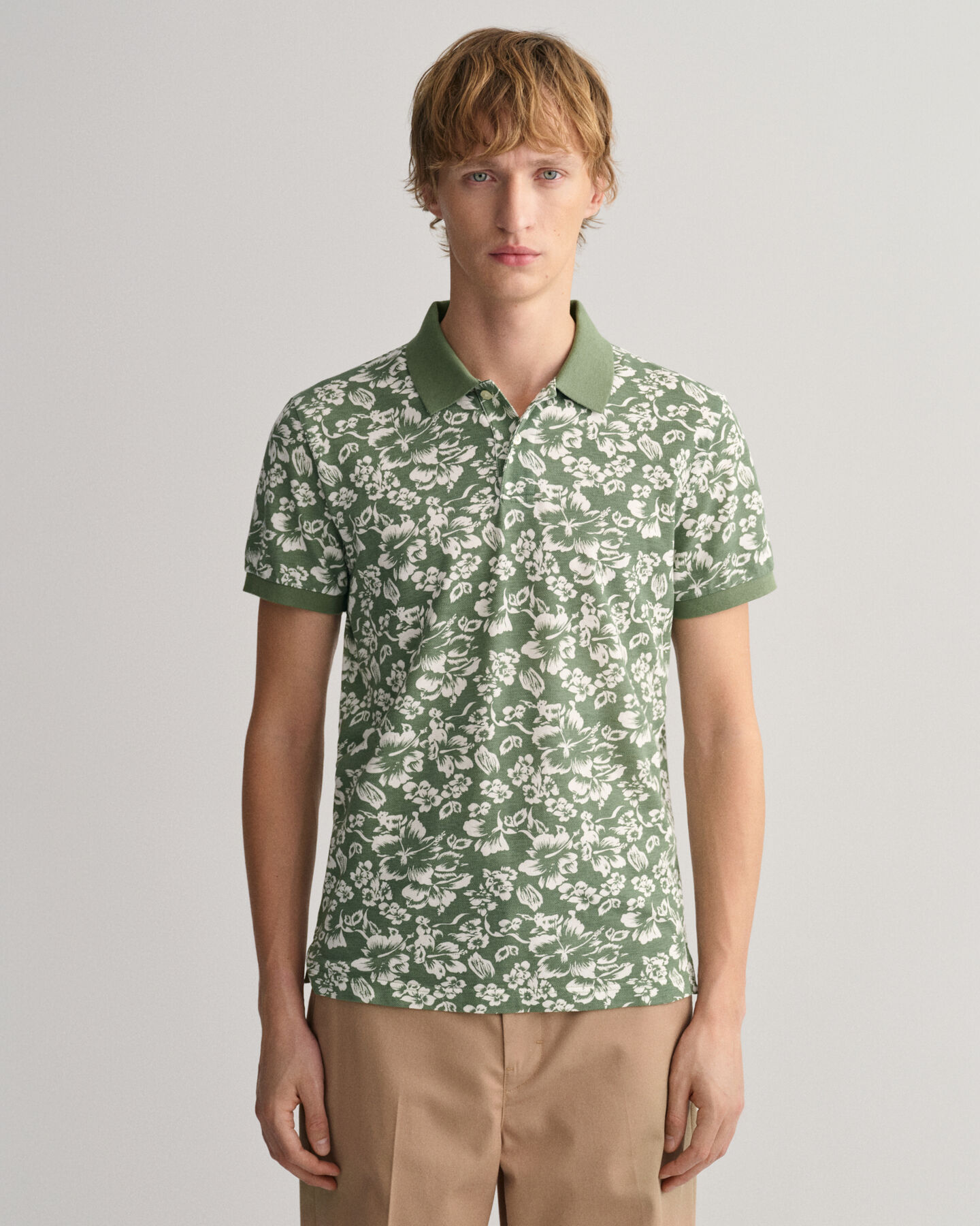 Piqu&eacute; poloshirt met bloemenprint