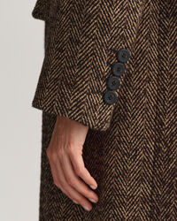 Overjas met visgraatmotief