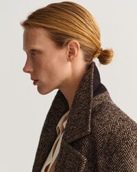 Overjas met visgraatmotief