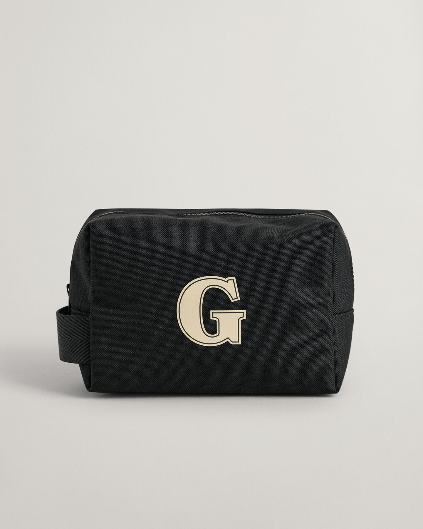 Trousse de toilette à écusson G