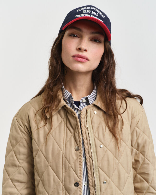 Manteau matelassé avec finitions en velours côtelé