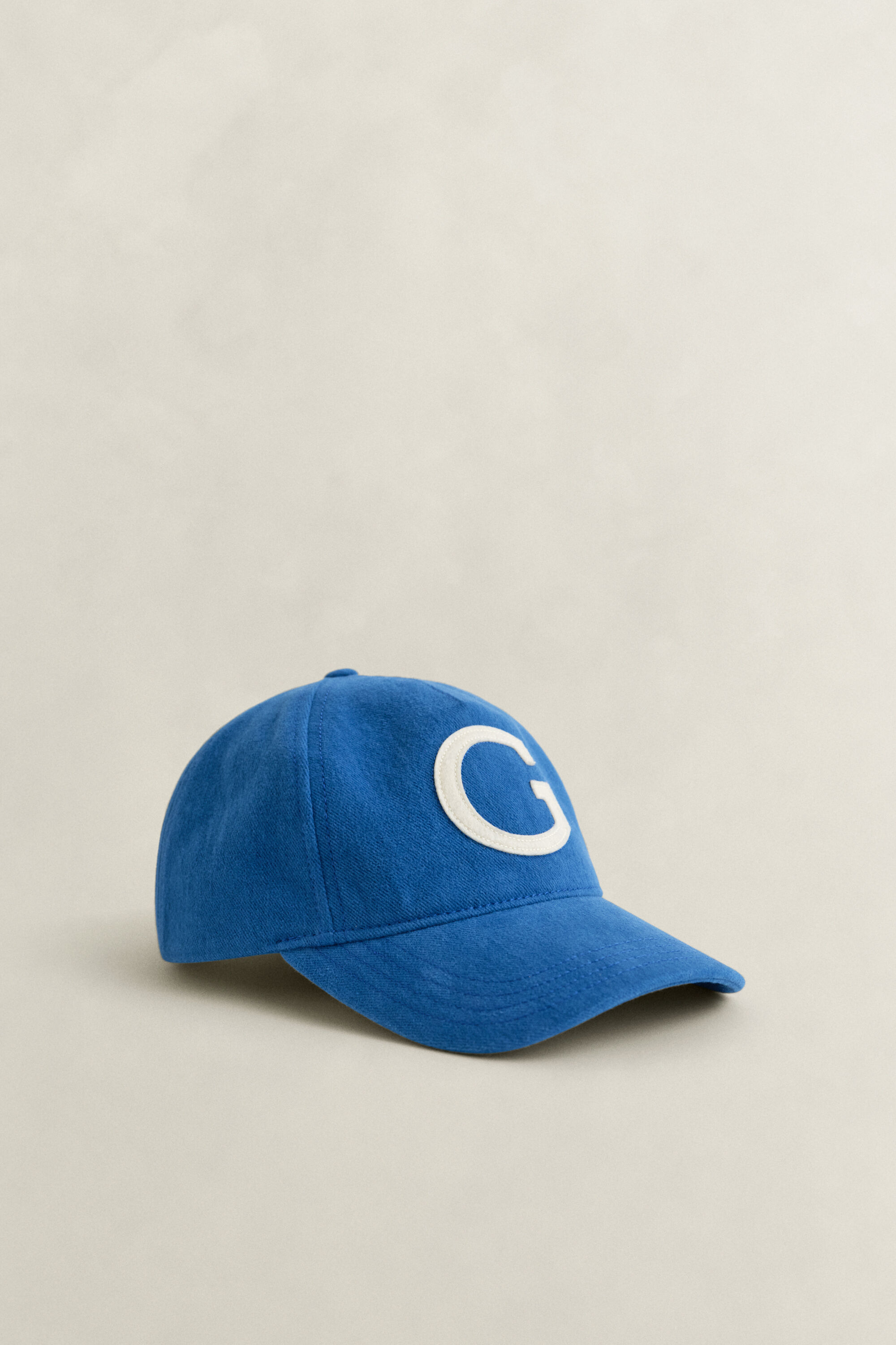 Moleskin pet met G-badge