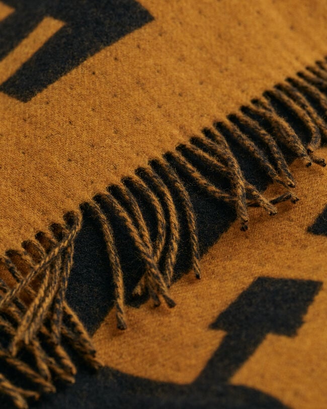 Poncho en laine Logo