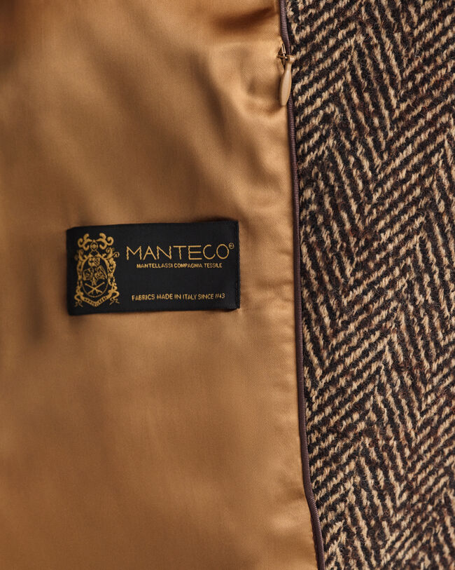 Overjas met visgraatmotief